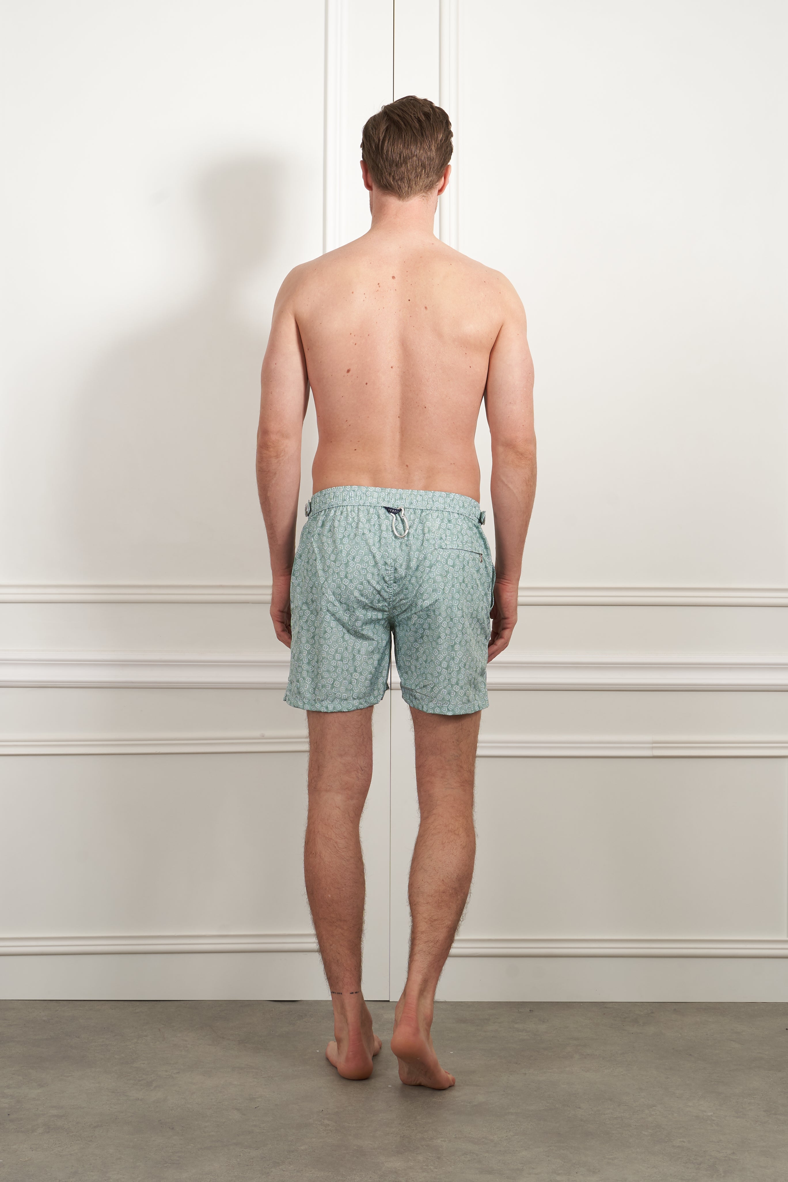 Patterned swim shorts in green