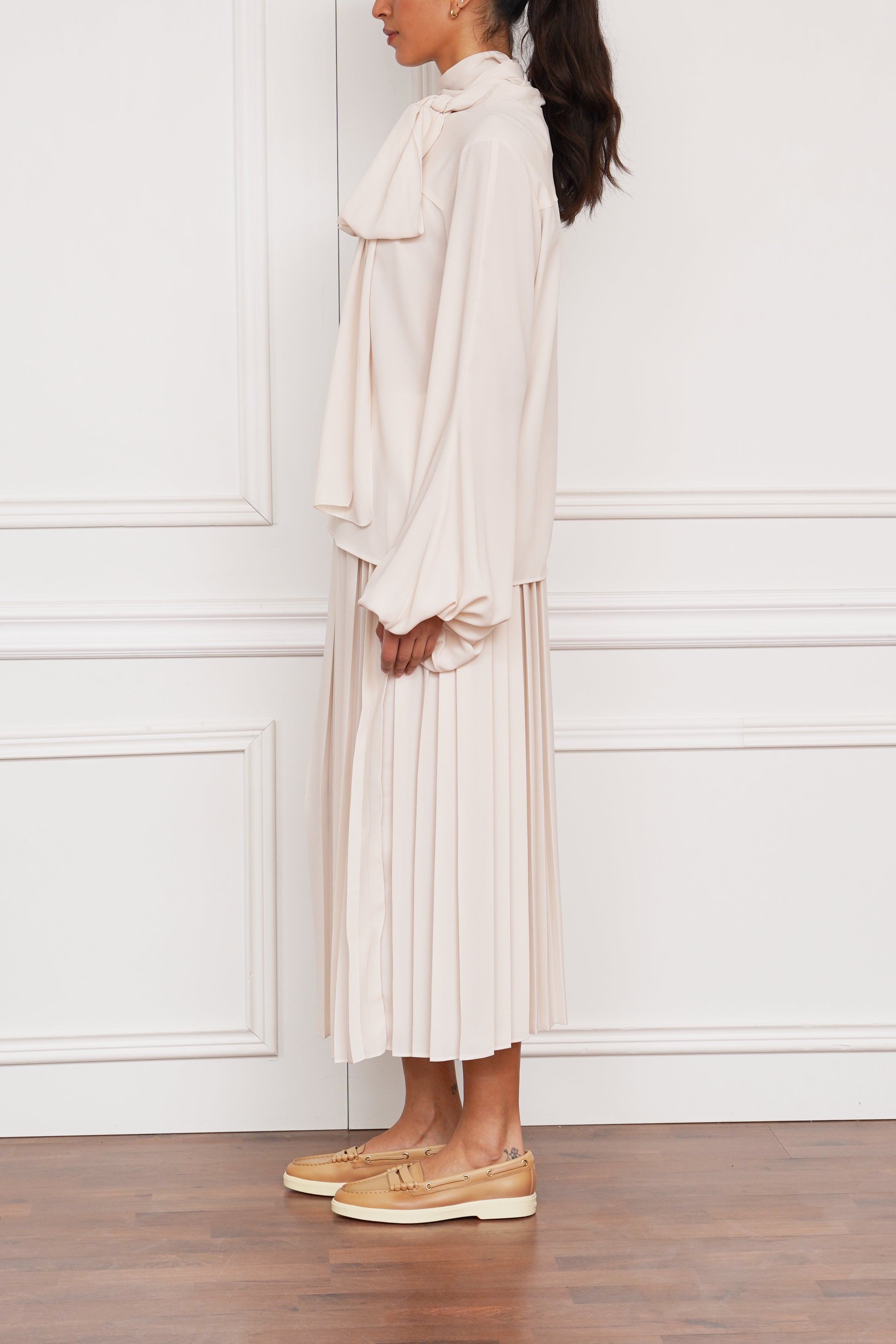 Schluppenbluse in creme