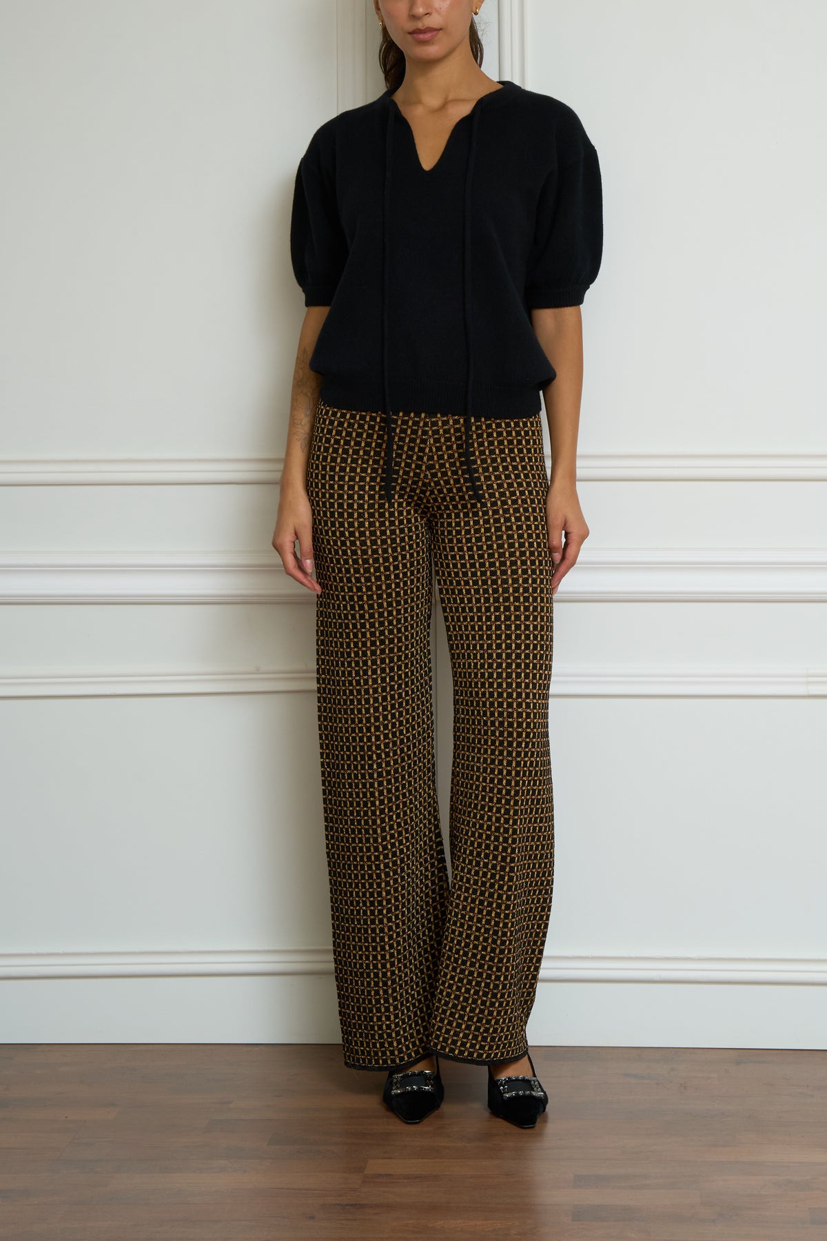 Gemusterte Glitzerhose in schwarz