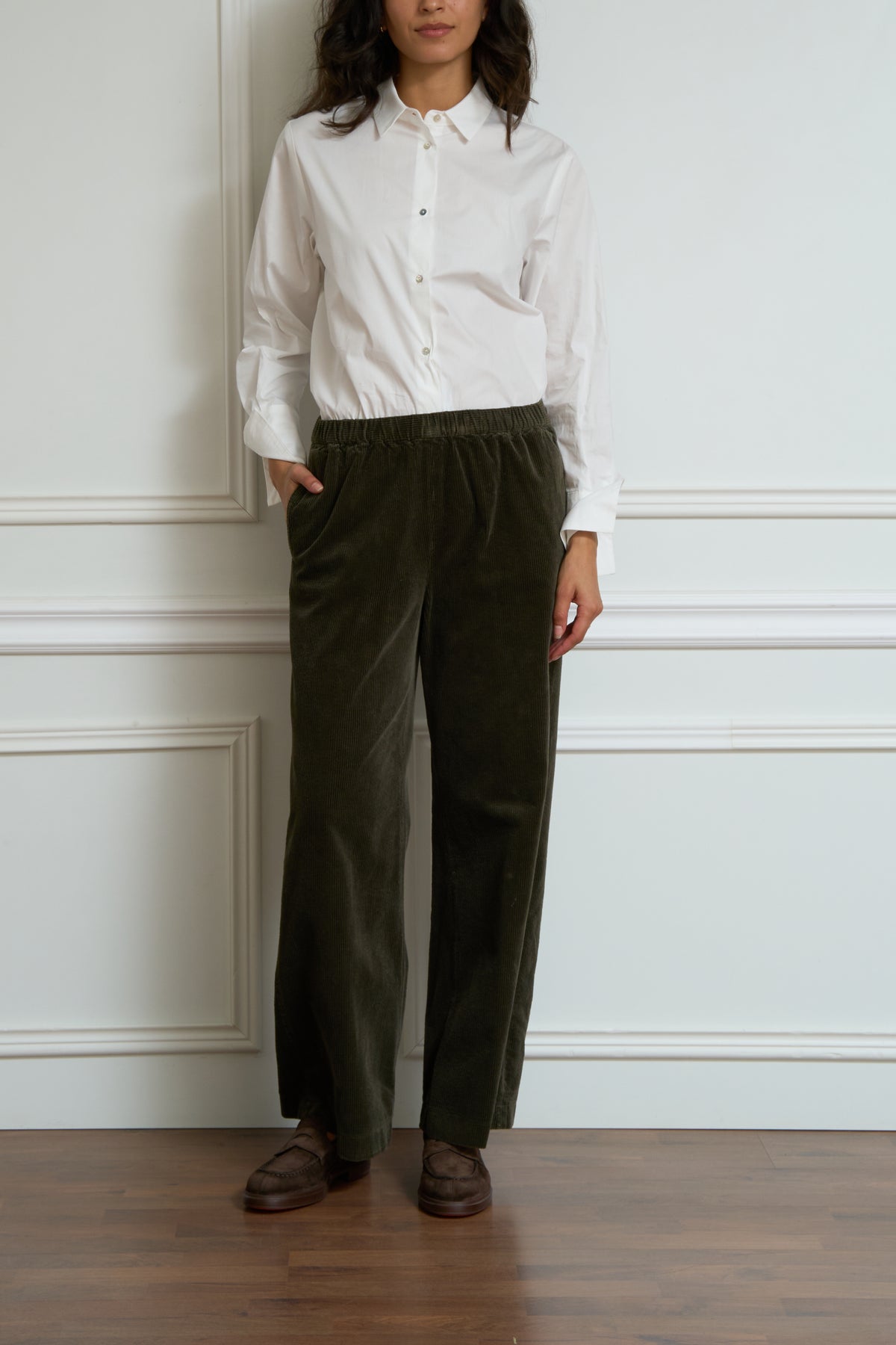 Green corduroy trousers
